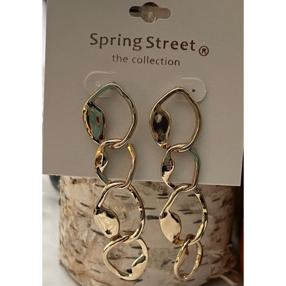 Spring Street dangling gold tone earrings